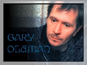 Gary Oldman,niebieskie oczy, wąsy